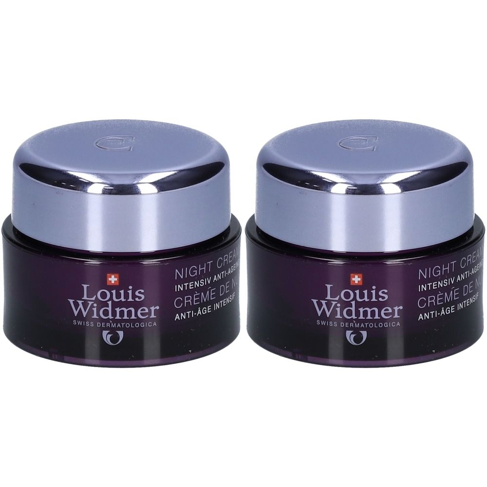 Deux pots de crème de nuit anti-âge intensif Louis Widmer. Pots violets foncés avec couvercles argentés. Inscription: Louis Widmer, Crème de Nuit.