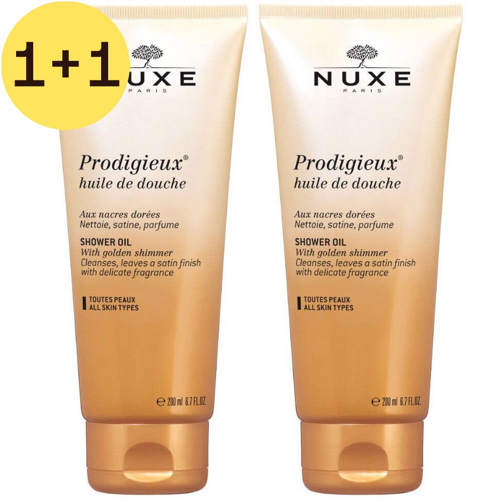 Deux tubes de Nuxe Prodigieux® huile de douche. Inscription 1+1 GRATUIT. Emballage doré avec nom et description du produit.
