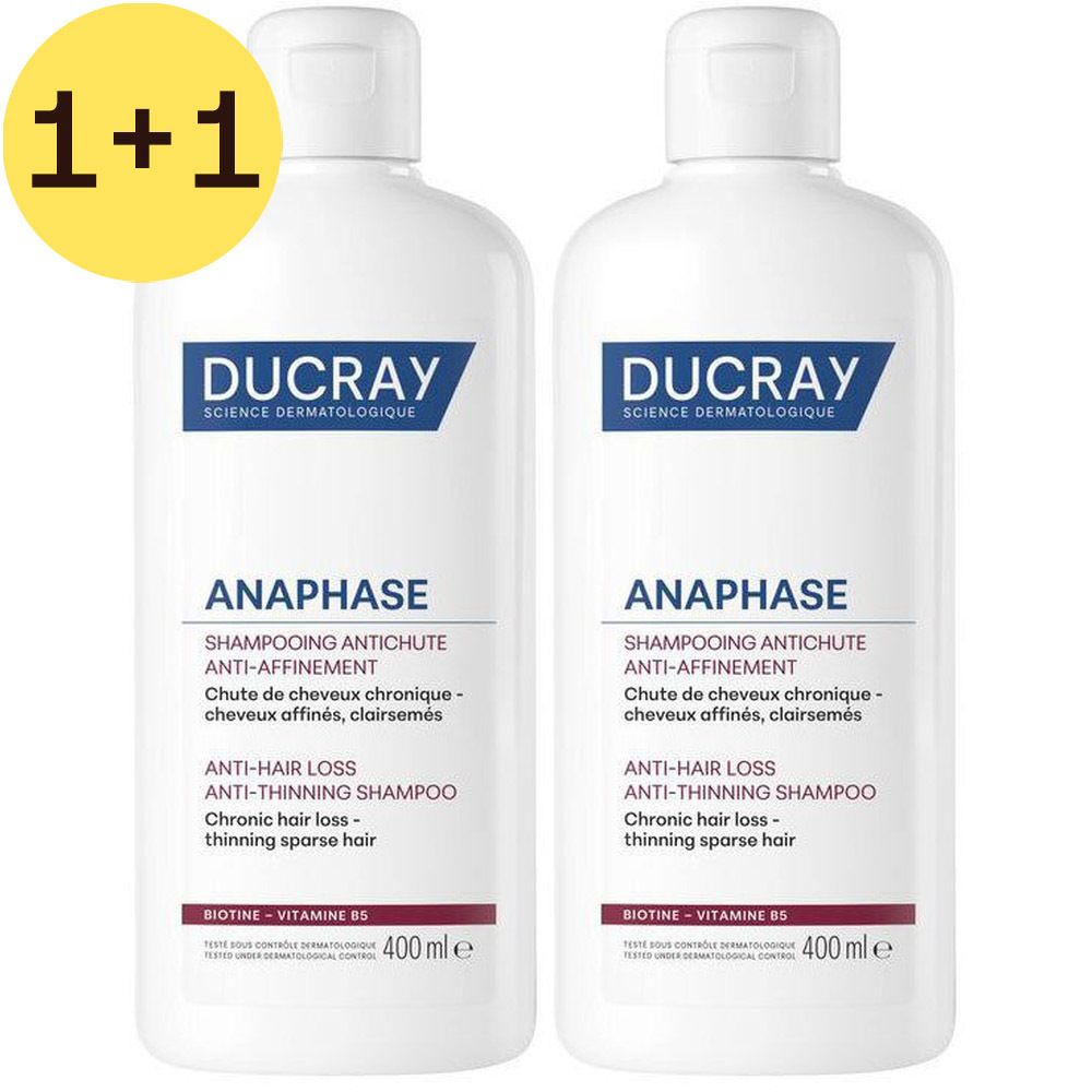 Twee witte shampoo flessen. Opschrift: DUCRAY, ANAPHASE, shampoo tegen haaruitval. 400 ml.