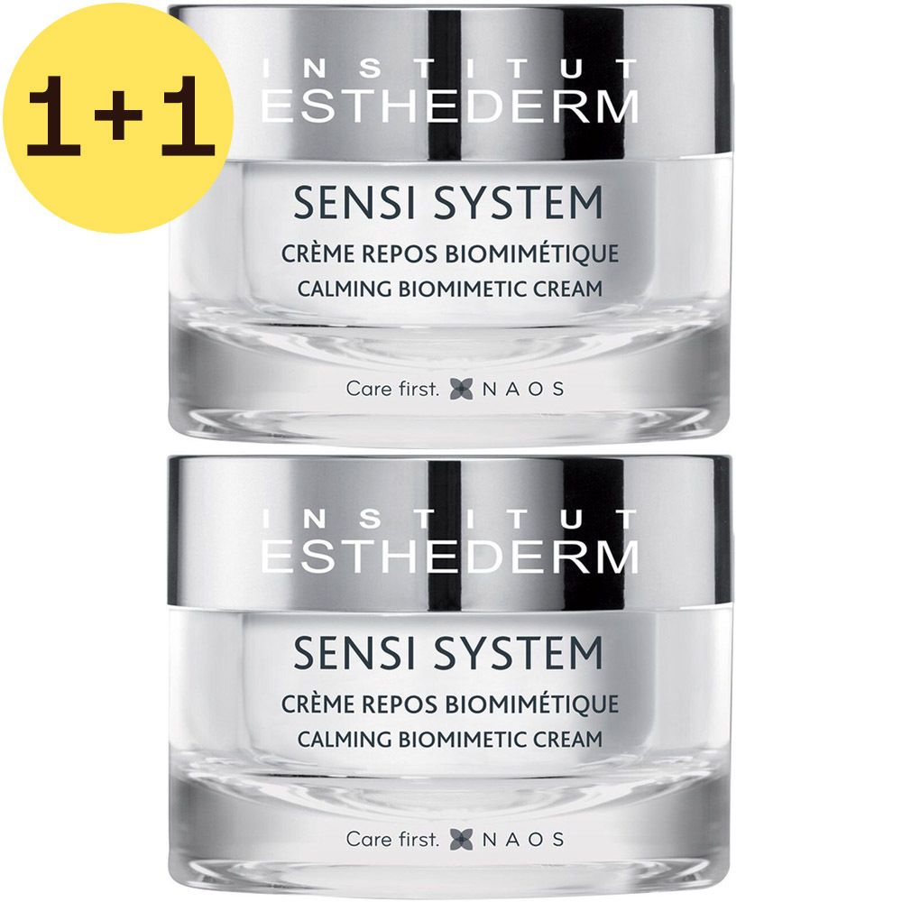 Twee crèmepotten, zilveren deksels, transparante potten. Opschrift: Sensi System, Crème Repos Biomimétique, Calming Biomimetic Cream. 1+1 gratis.