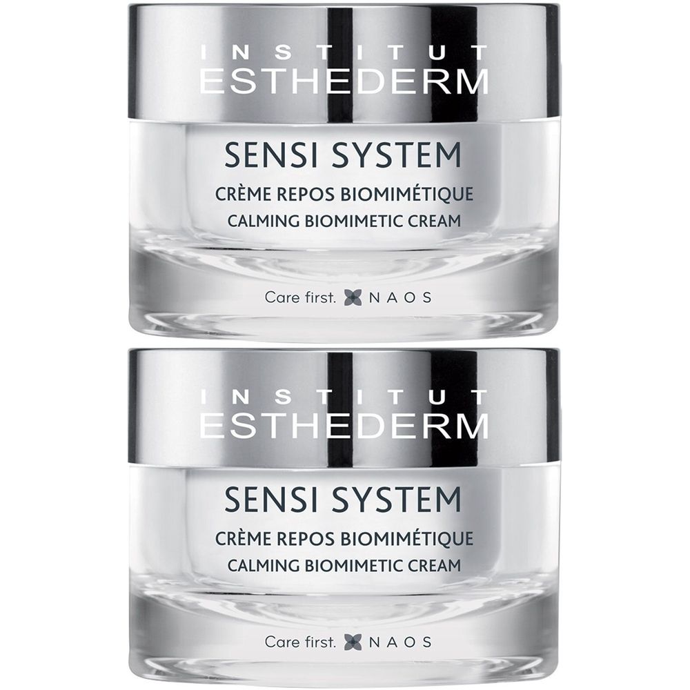 Twee crèmetubes. Opschrift: INSTITUT ESTHEDERM, SENSI SYSTEM, CRÈME REPOS BIOMIMÉTIQUE, CALMING BIOMIMETIC CREAM. Zilverkleurige deksels.