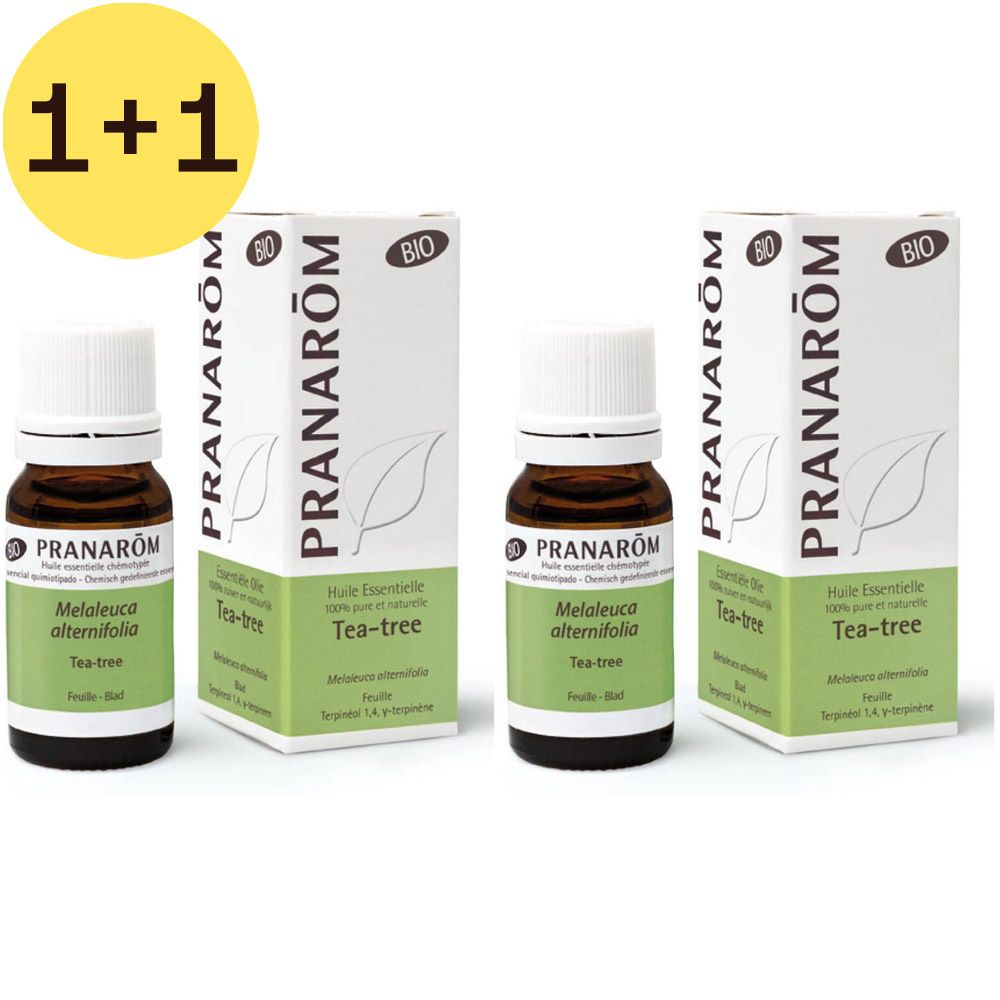 Twee flessen en twee dozen. Opschrift: Pranarôm, Tea-tree, Bio. Gele cirkel met "1+1". 