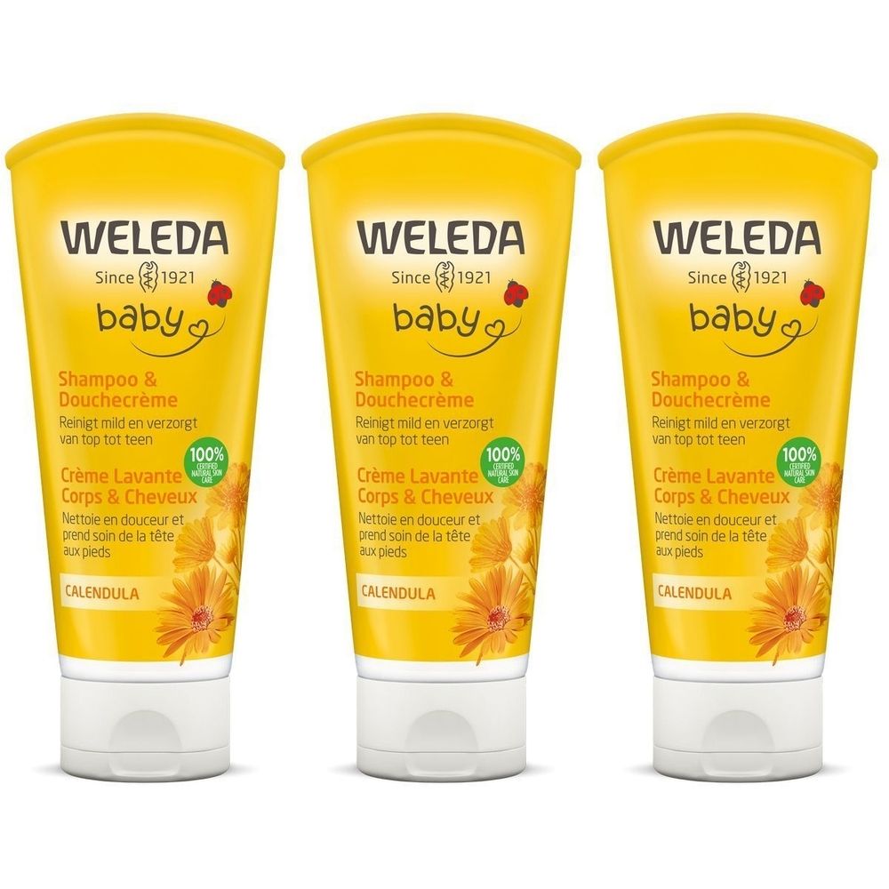Trois tubes de crème lavante Weleda Baby. Emballage jaune avec bouchon blanc. Texte et logo visibles.