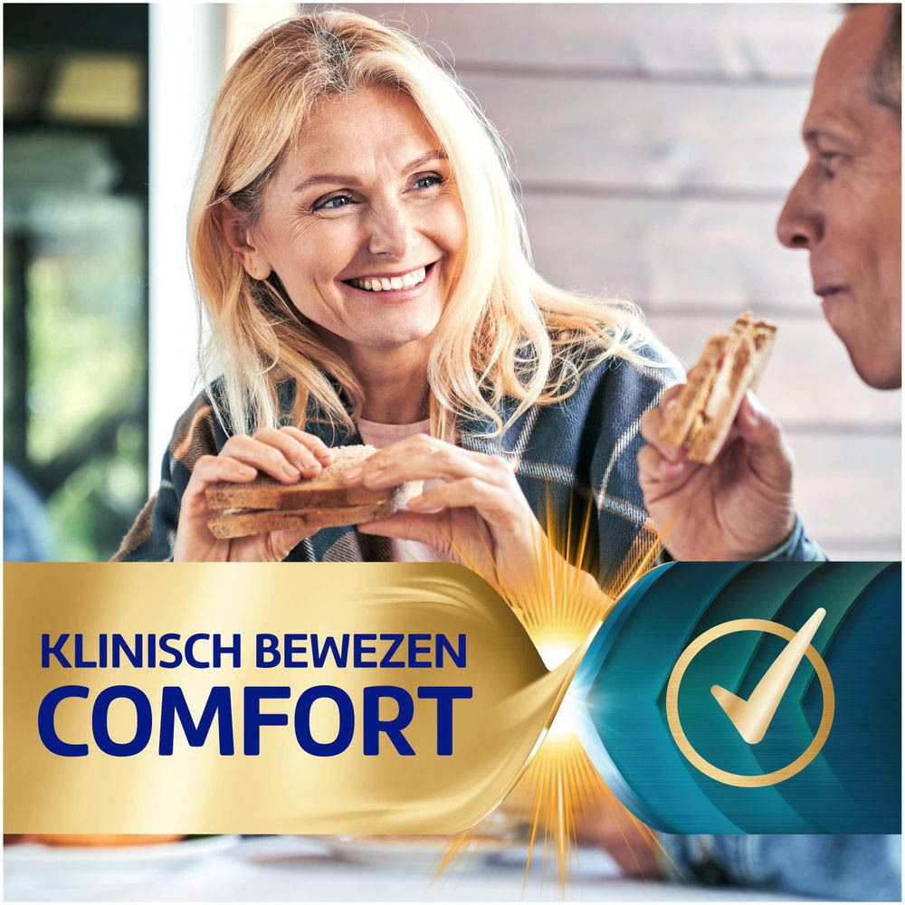 Vrouw eet spies. Tekst: "ONZE ULTIEME BIJTKRACHT" en "263% FIXATIE".