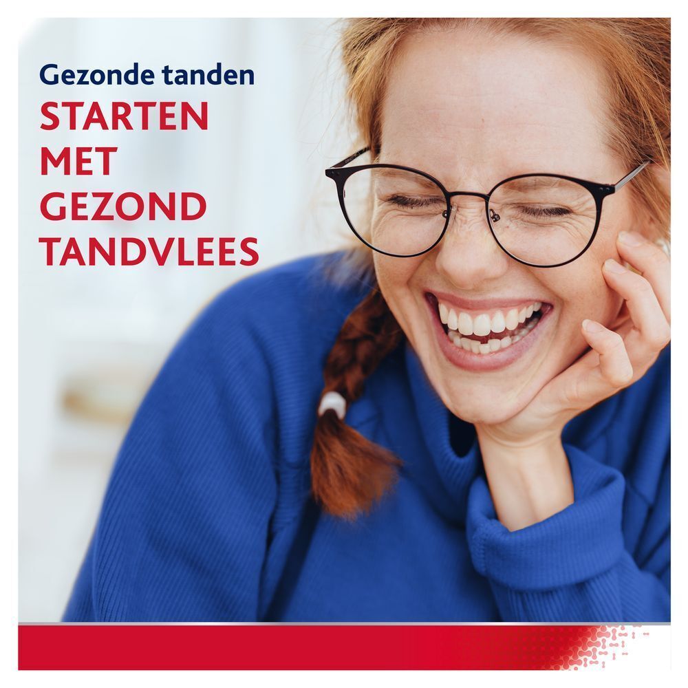 Lachende vrouw. Tekst: Gezonde tanden STARTEN MET GEZOND TANDVLEES.