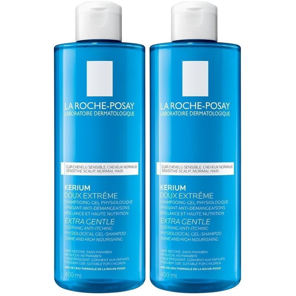 Deux flacons bleus de shampooing La Roche-Posay Kerium Doux Extreme. Bouchons blancs, étiquette blanche avec texte. 400 ml.