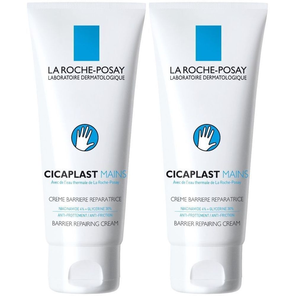 Twee witte tubes La Roche-Posay Cicaplast Mains handcrème. Blauwe logo's en tekst. Opschrift: Crème Barrière Réparatrice.