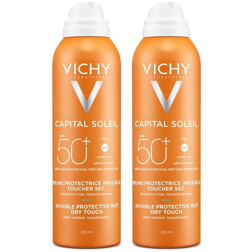 Twee oranje sprays met witte doppen. Opschrift: VICHY, CAPITAL SOLEIL, SPF 50+. Onzichtbare beschermende mist, droge aanraking.