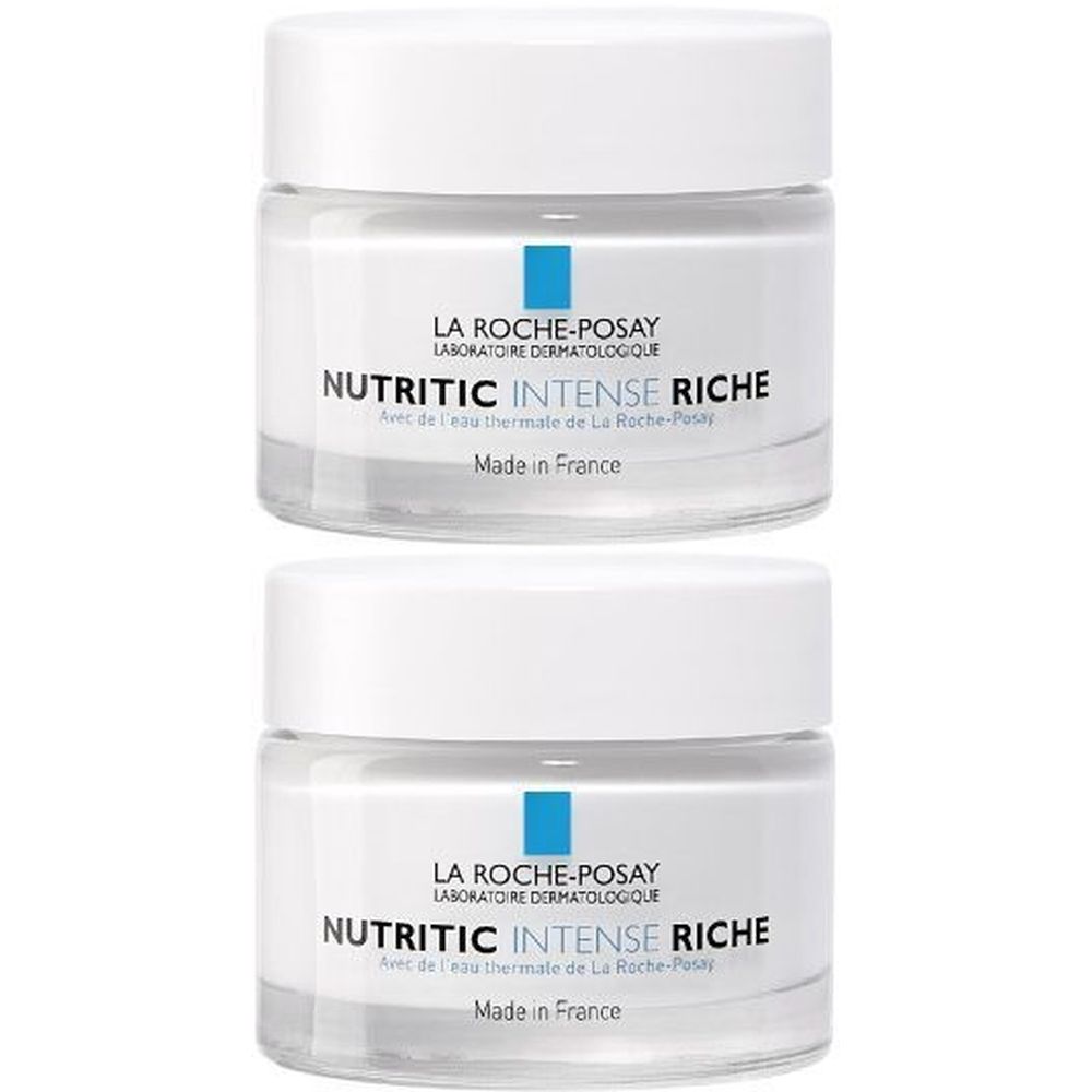 Deux pots de crème avec couvercles blancs et verre transparent. Inscription: La Roche-Posay Nutritic Intense Riche. Fabriqué en France.