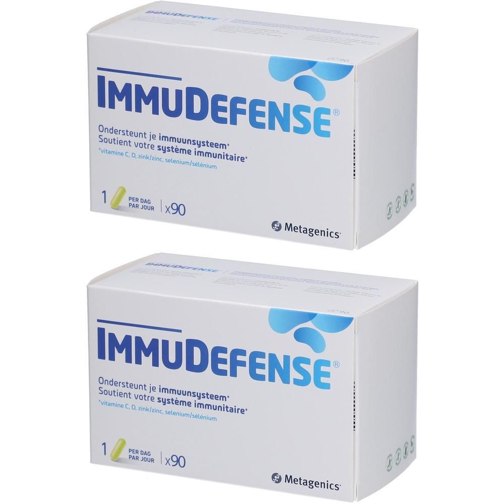 Twee witte dozen met blauwe tekst IMMUDEFENSE. Bevat 90 tabletten. Metagenics logo.
