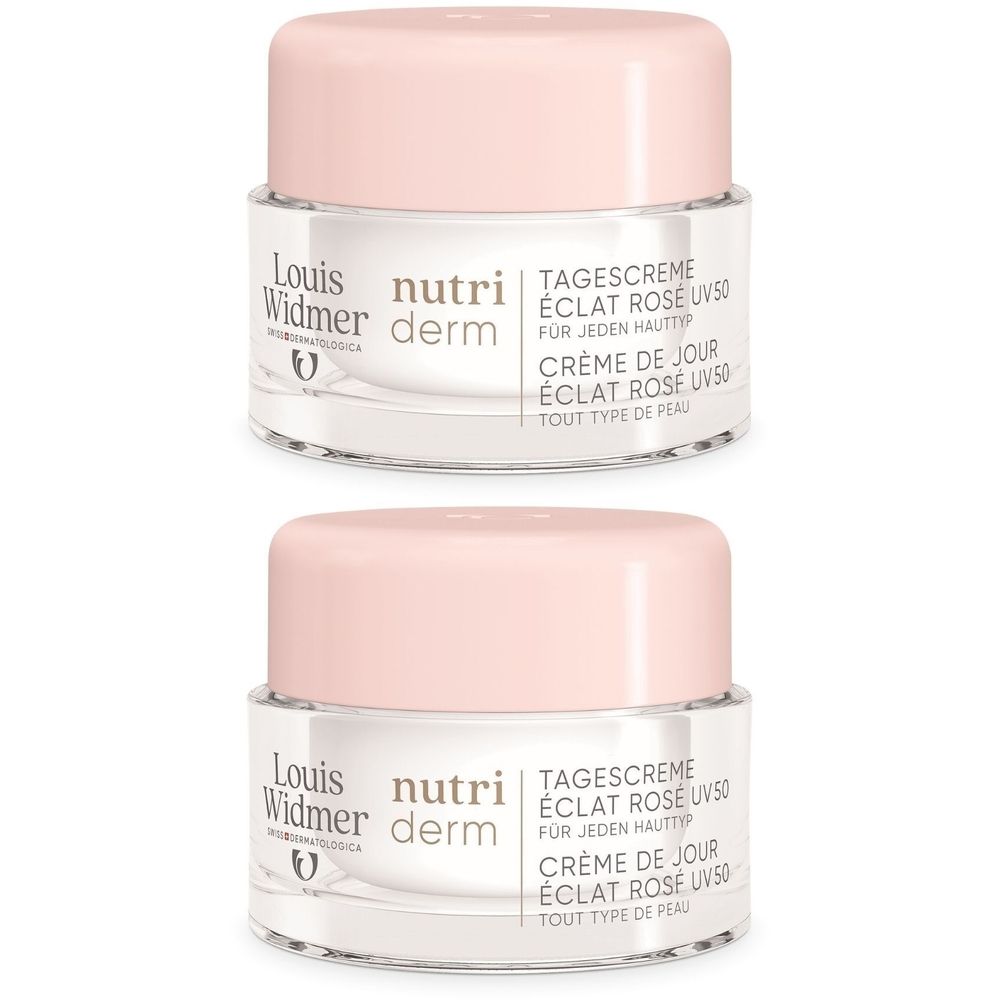 Deux pots de crème de jour avec couvercles roses. Inscription: Louis Widmer Nutriderm, Éclat Rosé UV50. Pour tous types de peau.