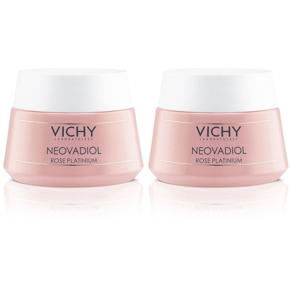 Deux pots roses avec couvercles blancs. Inscription : VICHY, NEOVADIOL ROSE PLATINIUM. Produit cosmétique.