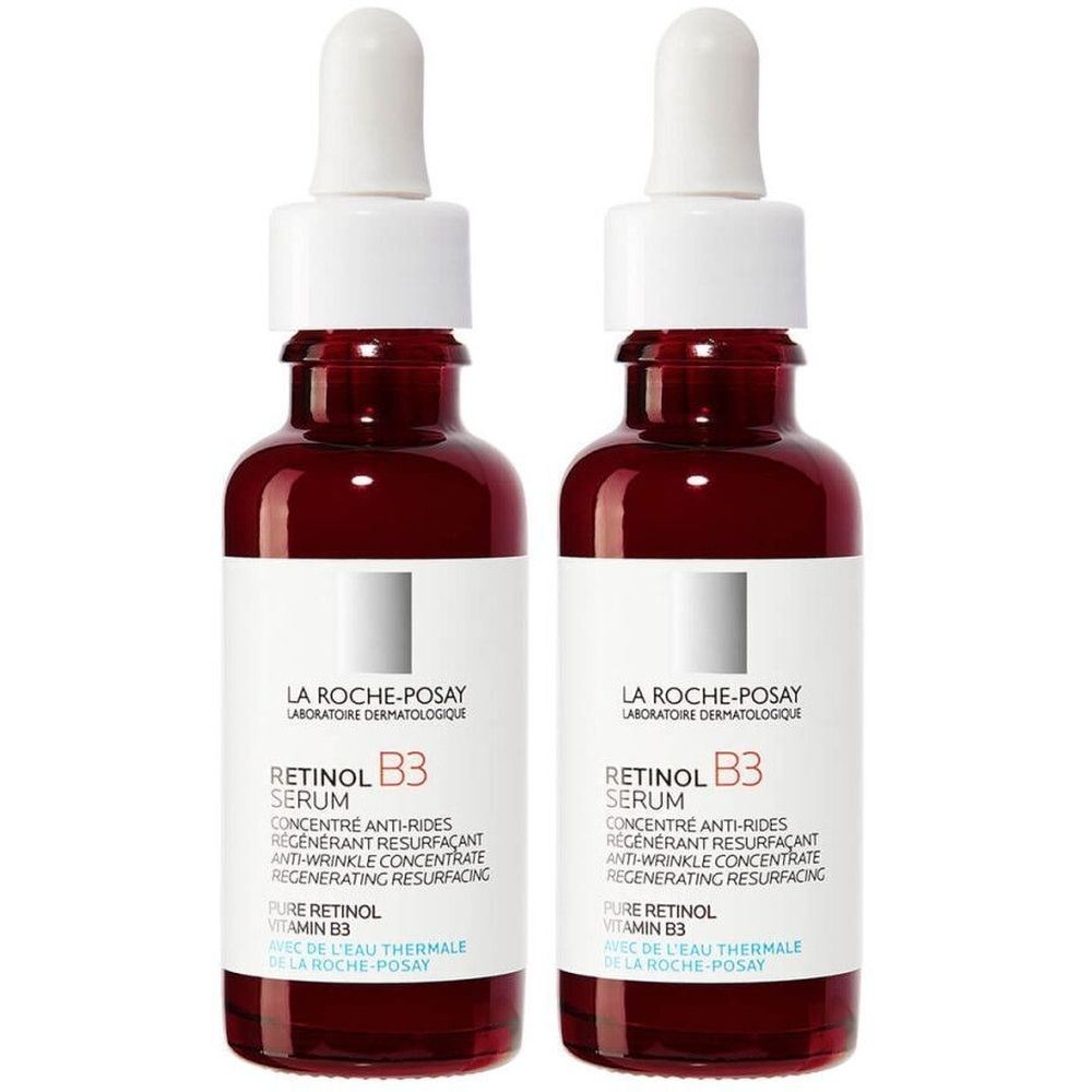 Twee flacons La Roche-Posay Retinol B3 Serum. Rode glazen flacons met witte doppen en pipetten. Opschrift: Retinol B3 Serum.