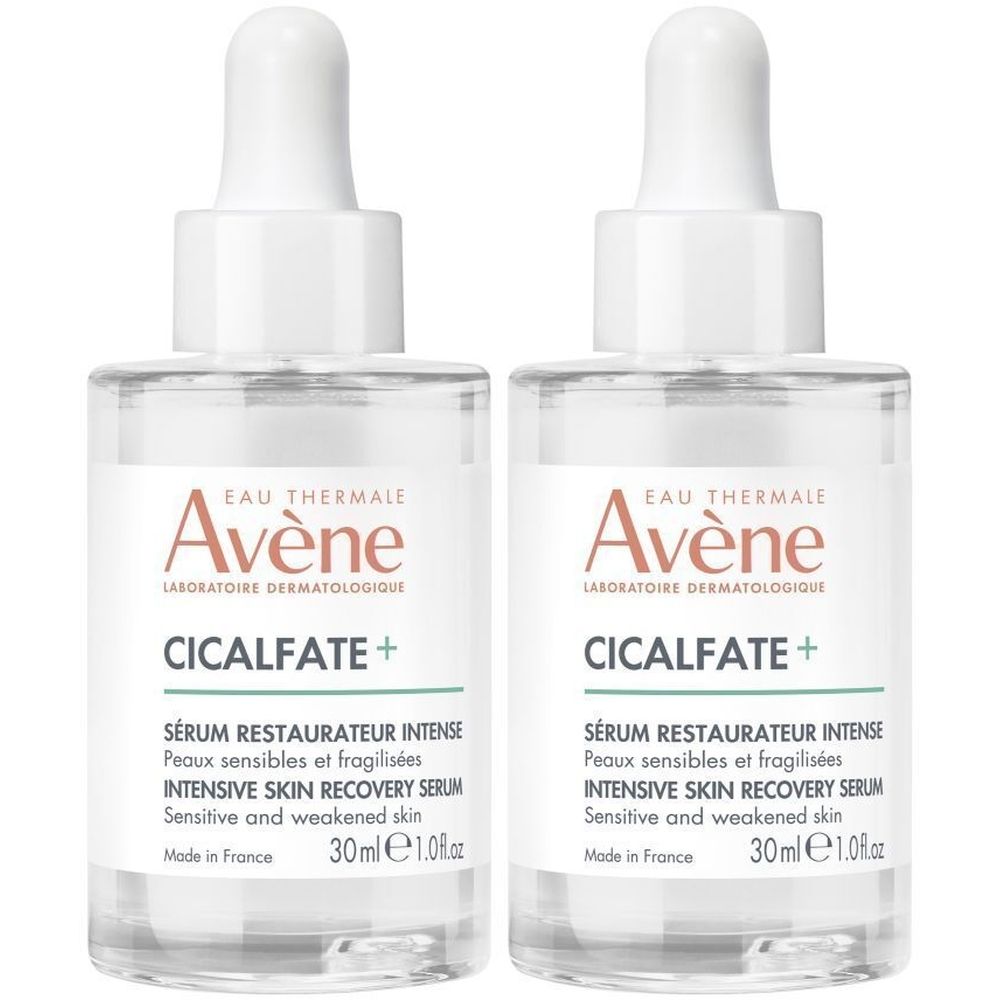 Deux flacons transparents avec bouchon blanc et pipette. Inscription: Avène Cicalfate+ Sérum restaurateur intense. 30ml.