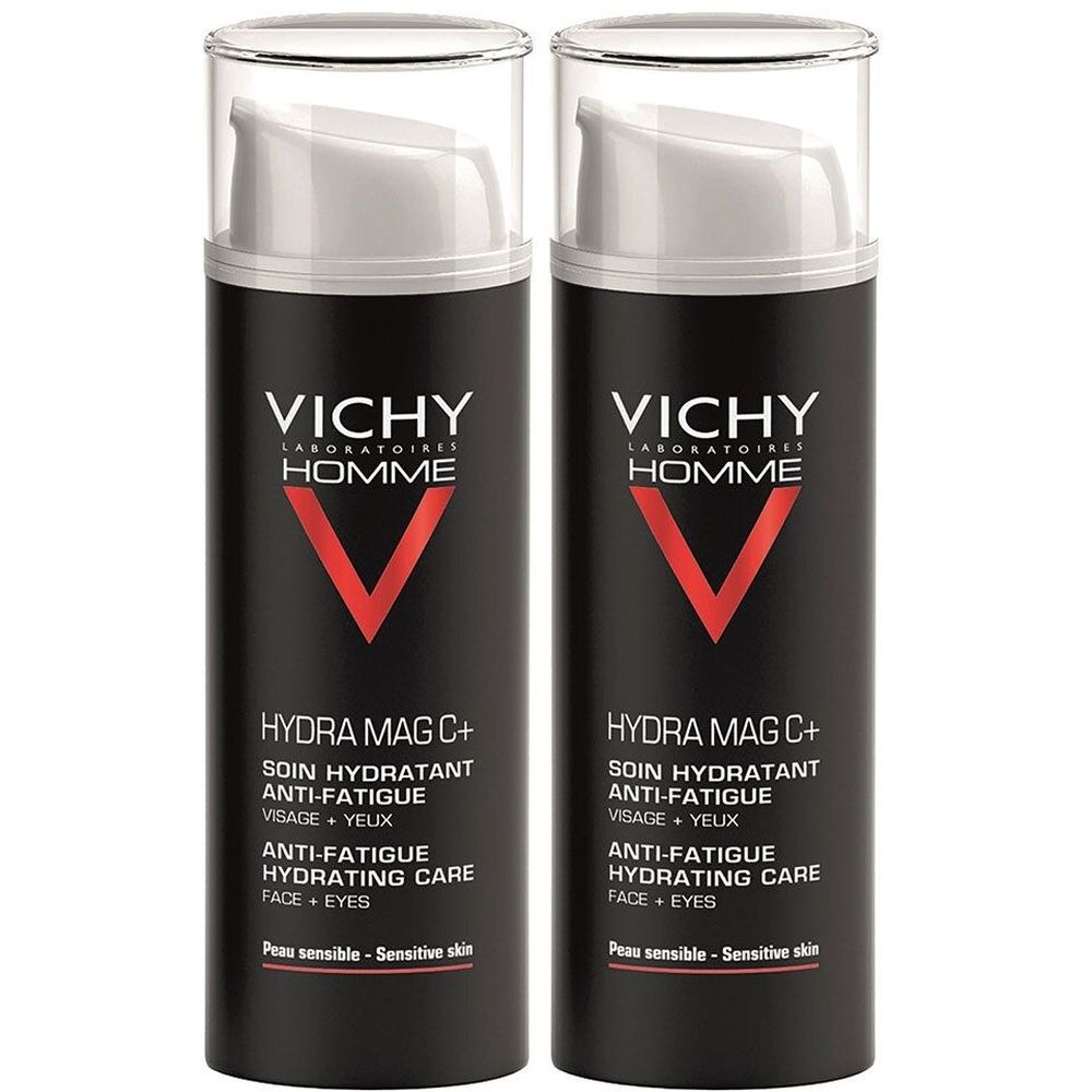 Twee zwarte flacons met witte pomp. Rood V-logo. Tekst: Hydra Mag C+, Anti-vermoeidheid, Gezicht + Ogen. Gevoelige huid.