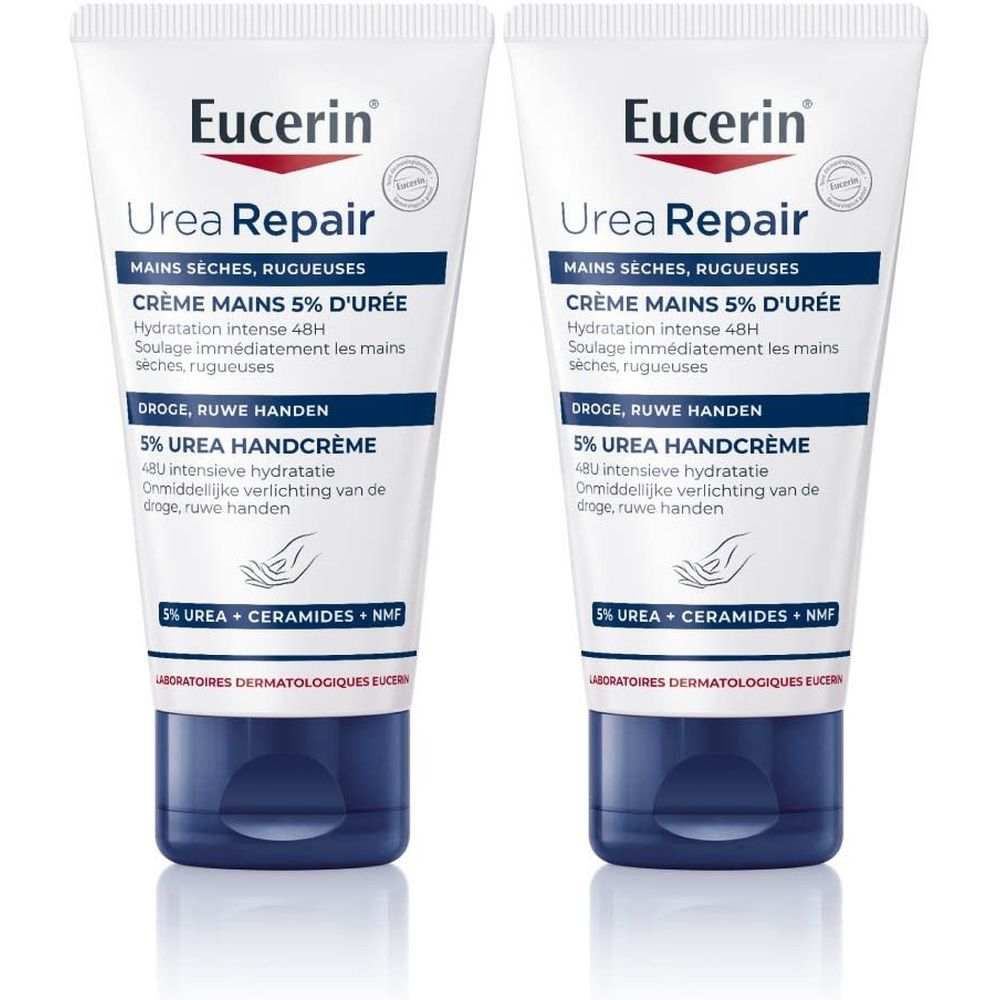 Twee tubes Eucerin Urea Repair handcrème. Witte tubes met blauwe doppen. Opschrift: 5% Urea, Ceramiden, NMF.