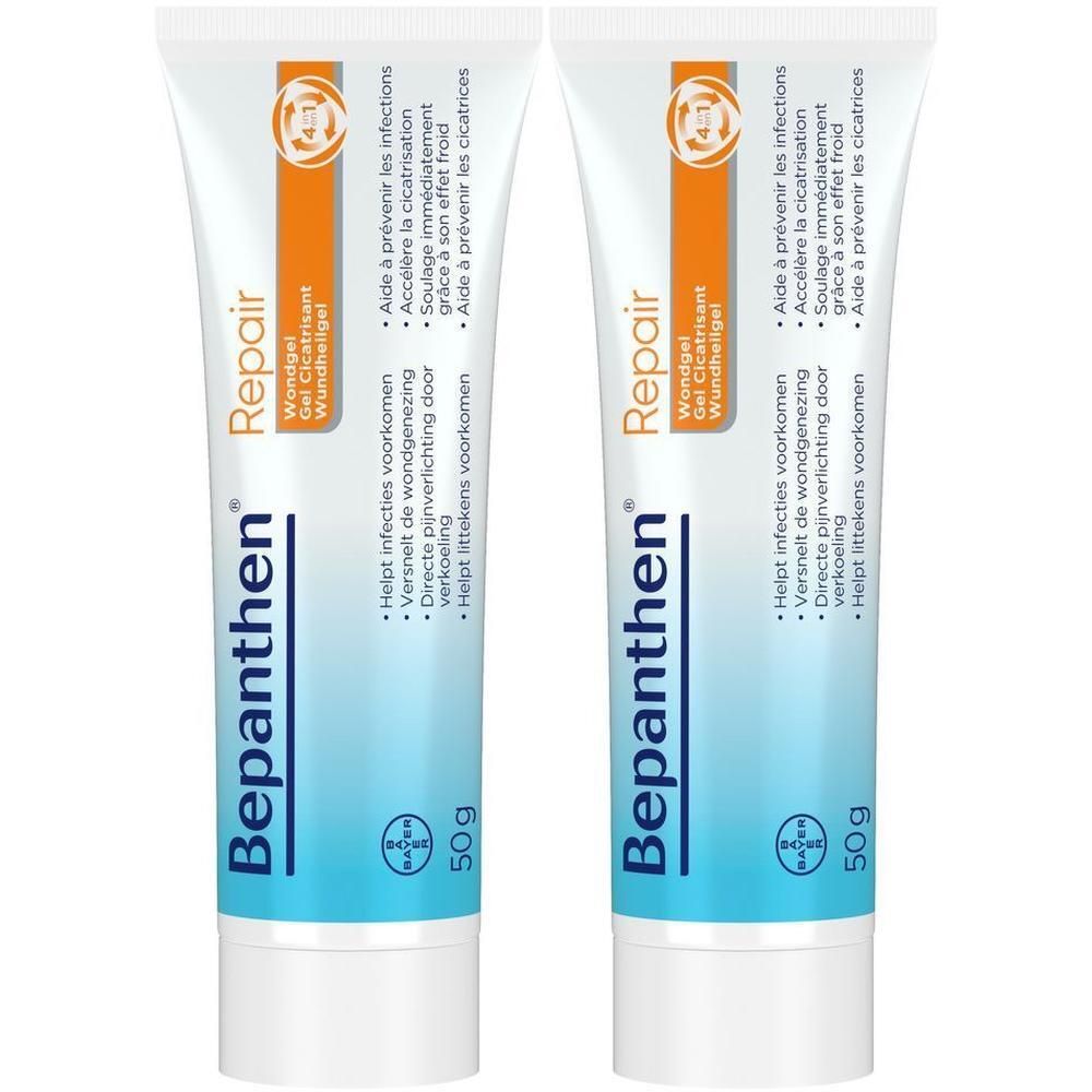 Twee tubes Bepanthen® Repair Wondgel. Blauwe en witte tube met oranje streep. Tekst: Bepanthen®, 50g, Wondgel Cicatrisant.