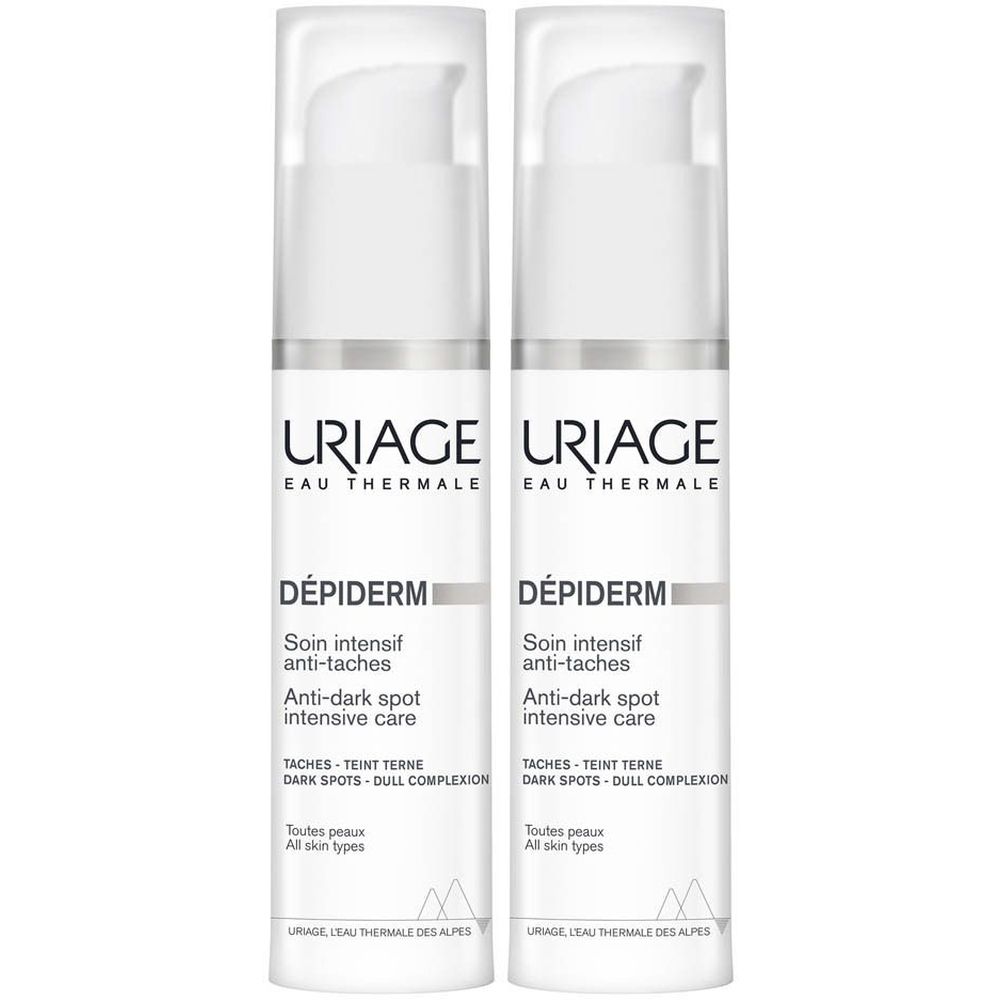 Twee witte flacons met pomp. Opschrift: URIAGE, DÉPIDERM, Anti-Taches. Voor alle huidtypes.
