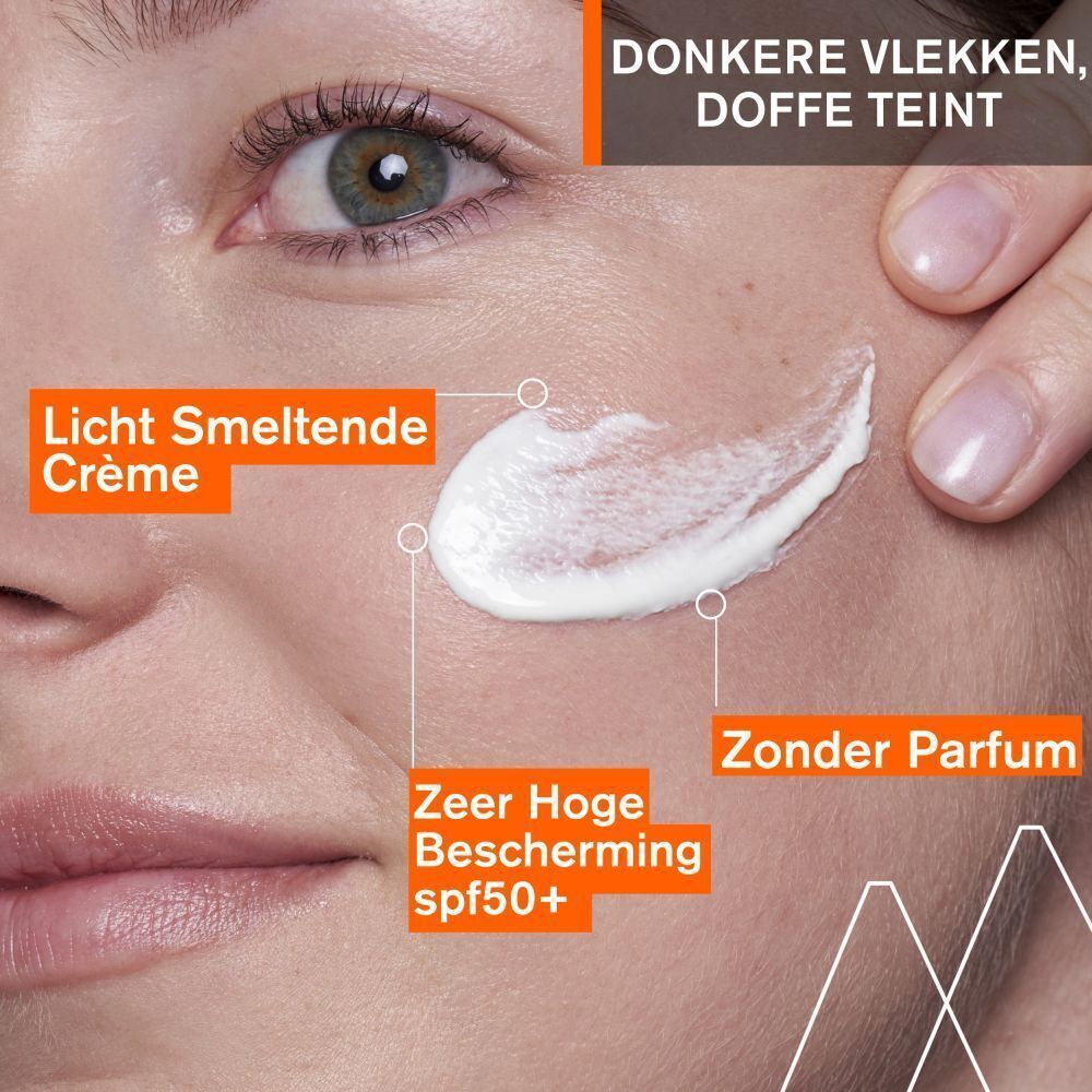 Doosje Uriage Dépiderm dagcrème SPF50+ tegen vlekken.