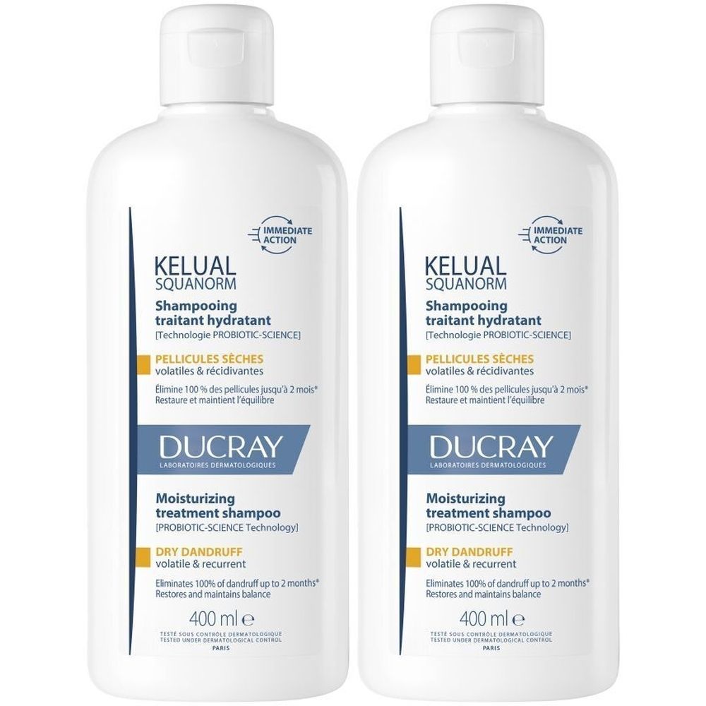 Twee witte shampoo flessen. Opschrift: KELUAL SQUANORM, Shampooing traitant hydratant, Ducray. 400 ml.