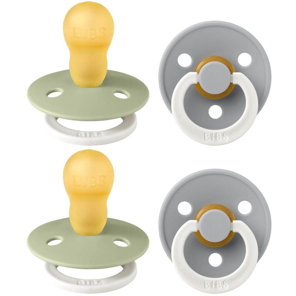 Vier fopspenen. Twee saliegroen, twee grijs. Ronde vorm met ring en speen. Merk BIBS zichtbaar.