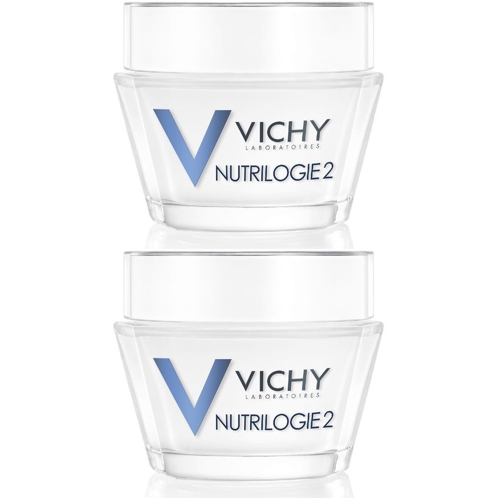 Deux pots de crème VICHY Nutrilogie 2. Récipients en verre avec couvercles blancs. Logo V bleu et texte.