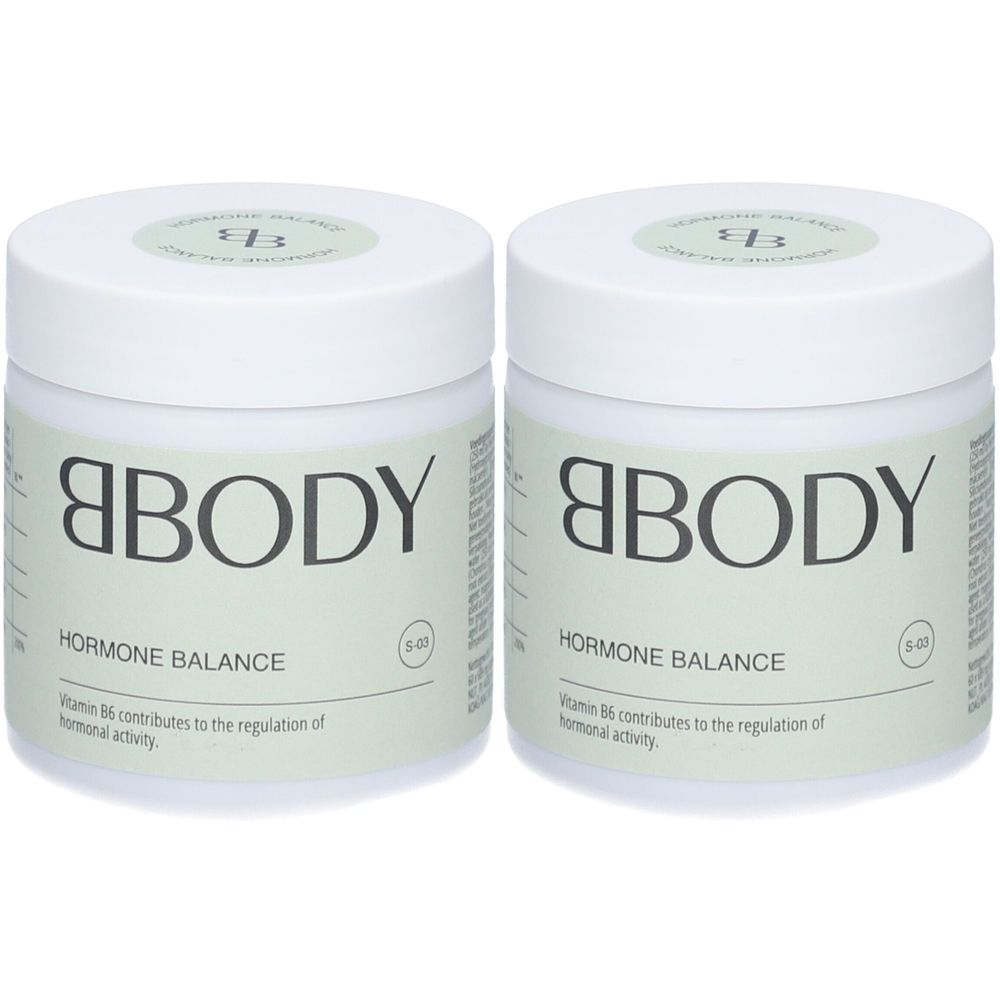 Deux pots blancs avec couvercles. Inscription : BBODY, HORMONE BALANCE. Texte : La vitamine B6 contribue à la régulation de l'activité hormonale.