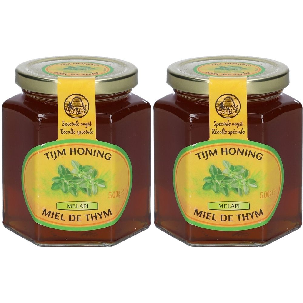 Twee potten honing met etiketten. Opschrift: Tijm Honing, Miel de Thym, Melapi. Gouden deksels en etiketten.