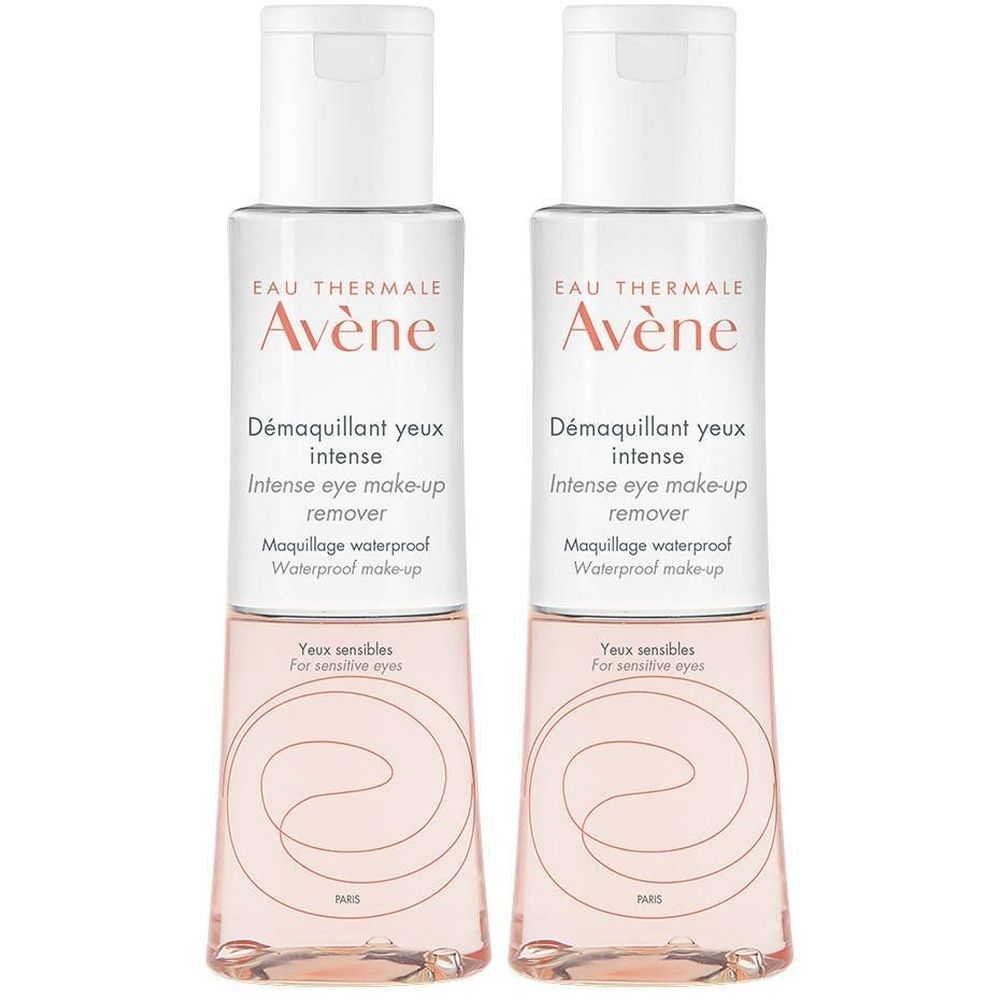 Twee flessen oogmake-up remover. Witte dop, transparante fles met roze vloeistof. Opschrift: Avène, Démaquillant yeux intense.