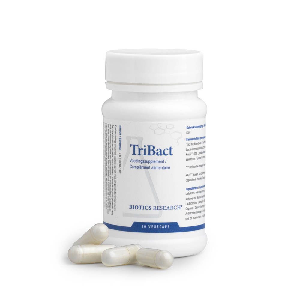 Een pot TriBact Voedingssupplement met vier capsules ervoor, 30 Vegicaps.