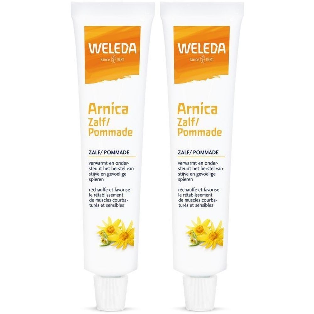 Twee tubes Weleda Arnica Pommade. Witte tubes met oranje logo en productnaam. Tekst in het Nederlands en Frans.