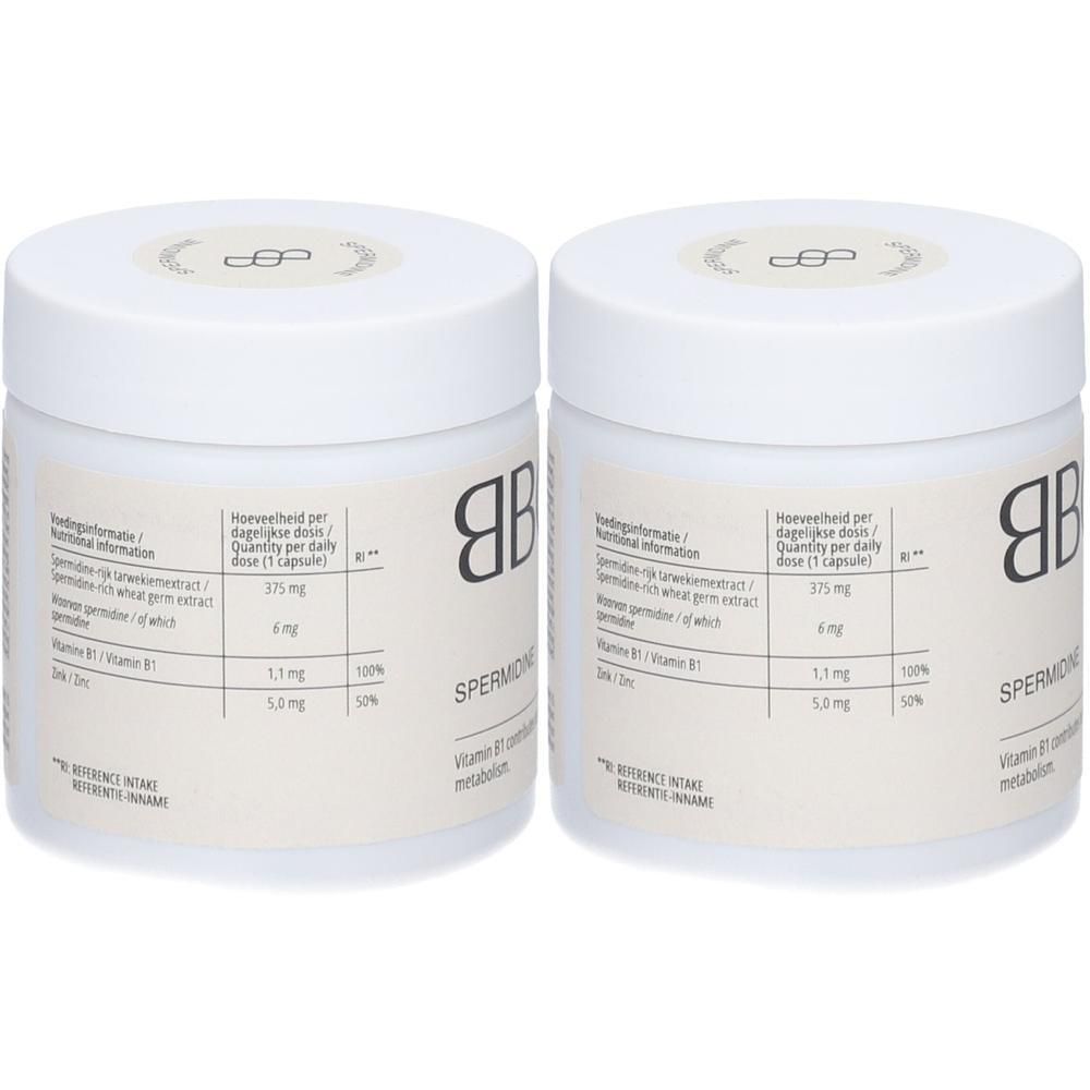 Twee witte potten met deksels. Opschrift BBODY en SPERMIDIN. Etiket met voedingswaarde en vitamine B1.