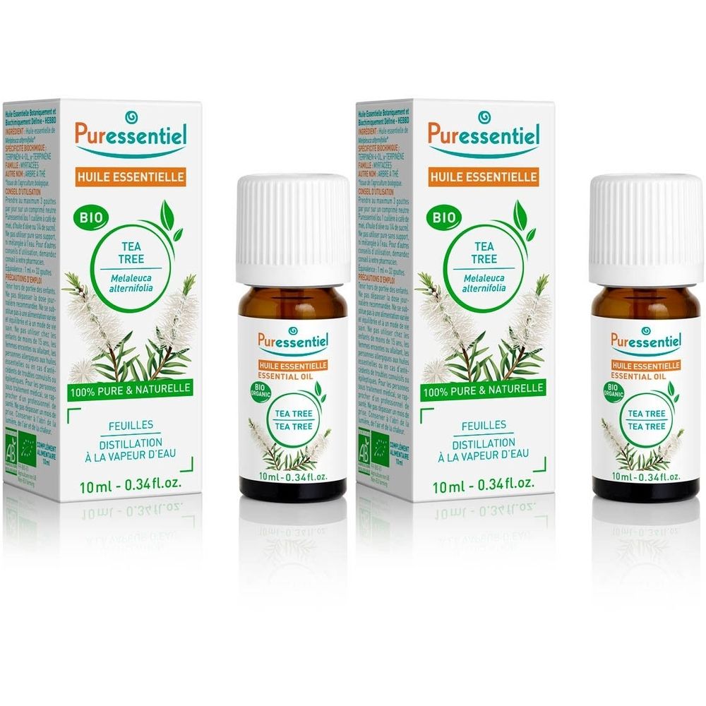 Trois flacons d'huile essentielle avec emballage. Inscription : "Tea Tree", "Bio".