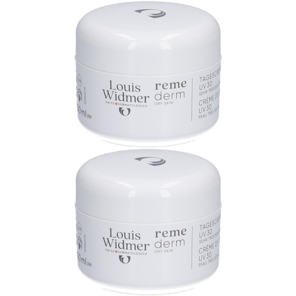 Twee witte crèmetiegels met deksels. Opschrift: Louis Widmer Remederm Dry Skin Crème Visage UV30. Logo en tekst.