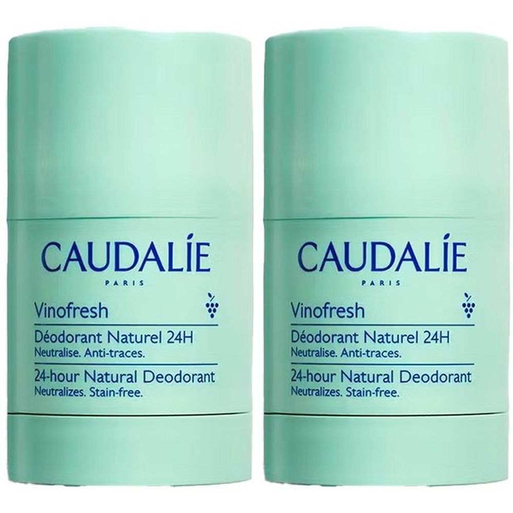 Twee cilindrische deodorants in lichtgroene verpakking. Opschrift: CAUDALIE, Vinofresh, Déodorant Naturel 24H. Neutraliseert. Vlekkeloos.