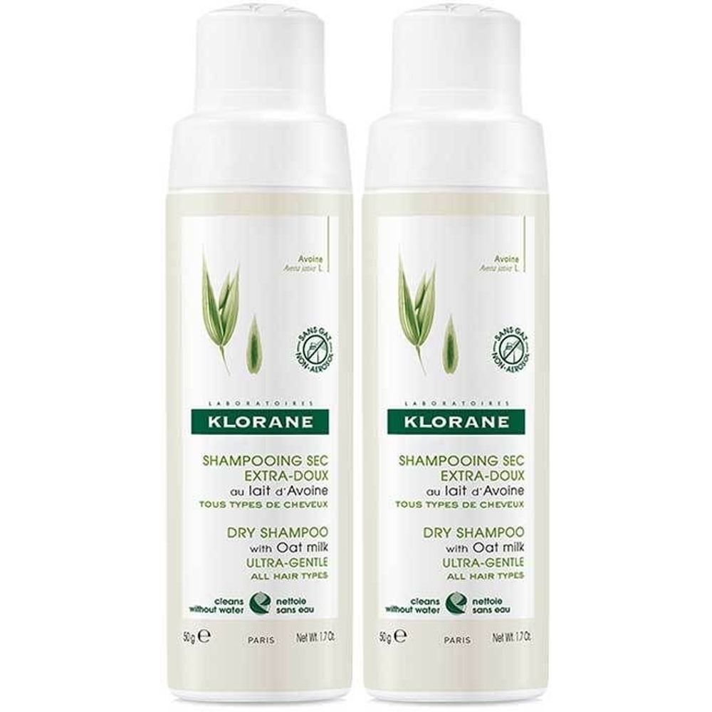 Deux flacons de shampooing sec Klorane. Inscription: Shampooing Sec Extra-Doux au lait d'Avoine, Dry Shampoo with Oat milk. Sans gaz.