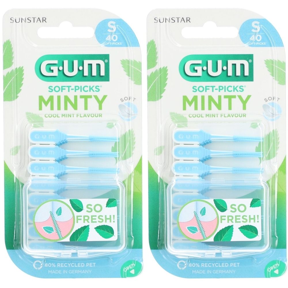 Deux paquets de GUM Soft-Picks Minty, petite taille, 40 pièces. Pics bleu clair dans des blisters transparents, emballage vert.