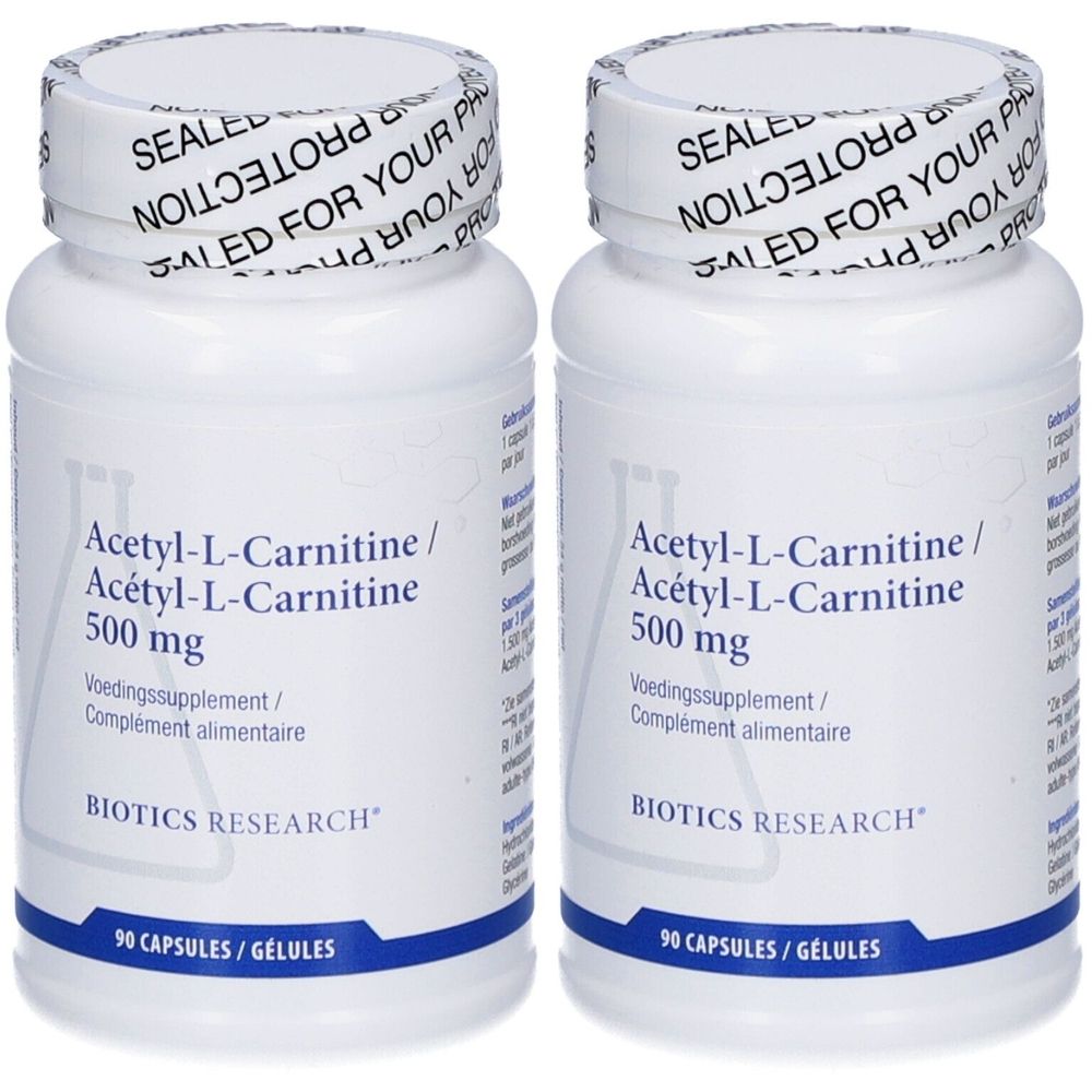 Twee witte flessen met schroefdop. Opschrift: Acetyl-L-Carnitine 500 mg, 90 capsules. Merk: Biotics Research. Verzegeling op de dop.
