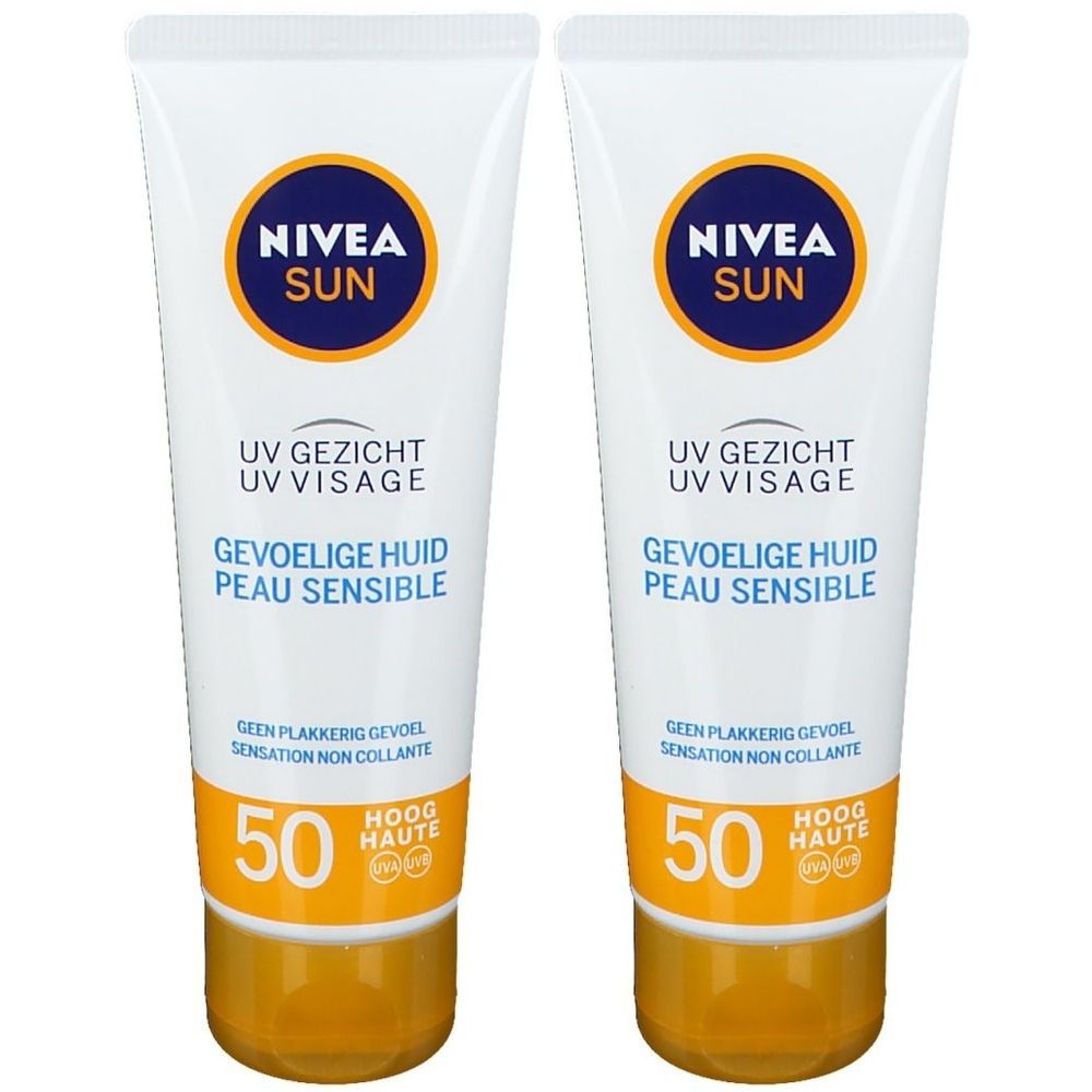 Deux tubes de Nivea Sun UV Visage. Blanc, logo bleu et base jaune. Texte: UV Visage, Peau Sensible, SPF 50.