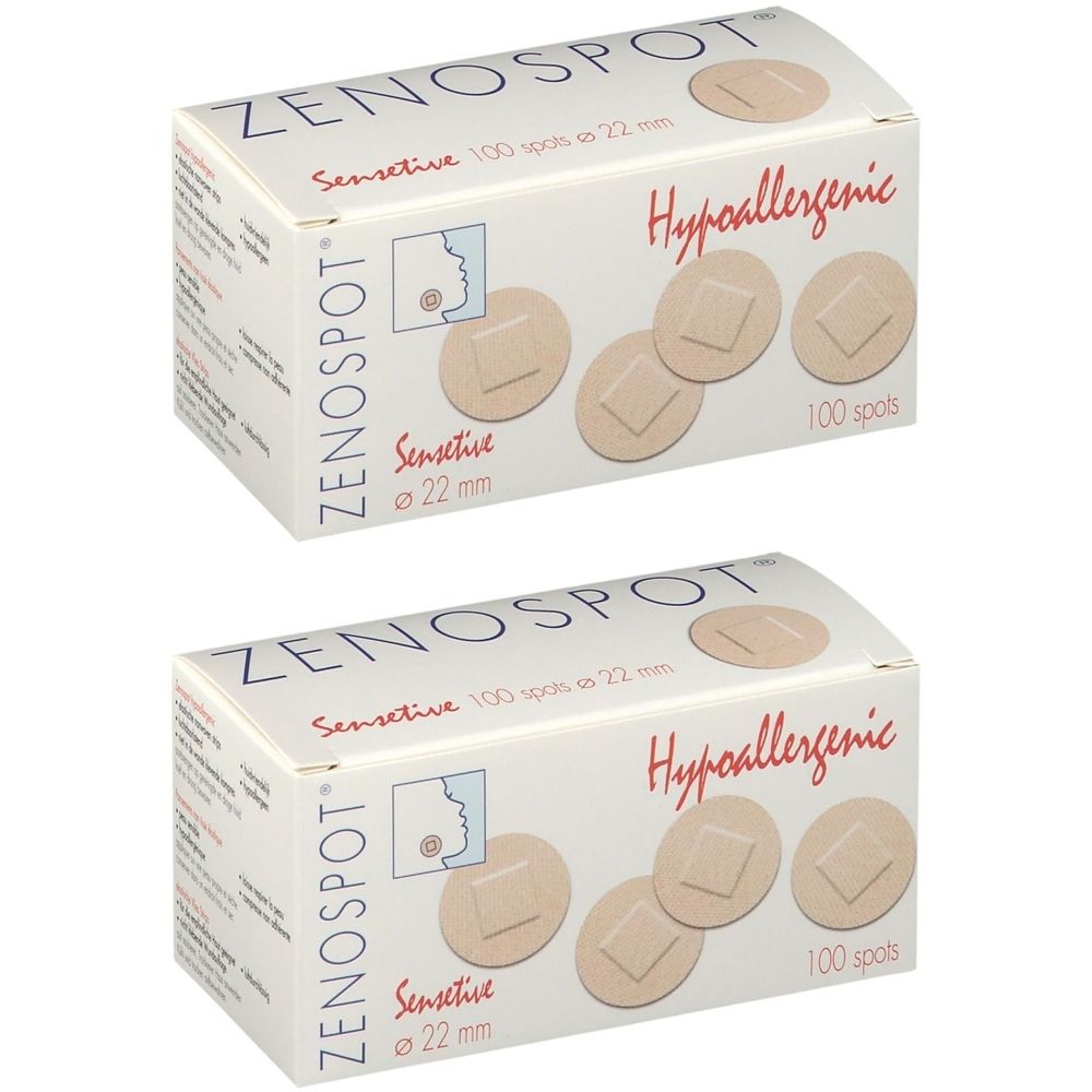 Deux boîtes de pansements ZENOSPOT Sensitive, 100 spots, ø 22 mm, hypoallergéniques. Les pansements ronds sont de couleur chair.