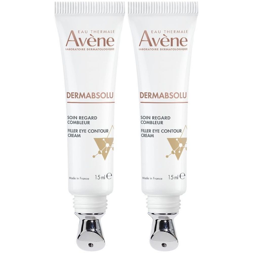 Deux tubes de crème pour les yeux Avène Dermabsolu. Tubes blancs avec applicateurs argentés. Texte: Dermabsolu, 15ml.