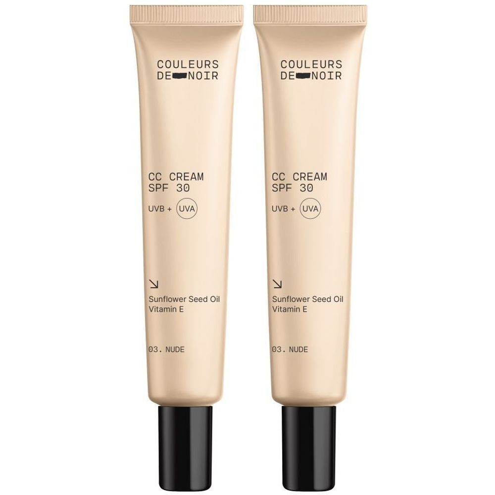 Twee tubes Couleurs de Noir CC CREAM SPF 30. Beige tubes met zwarte doppen. Tekst: CC CREAM, SPF 30, 03 Nude.