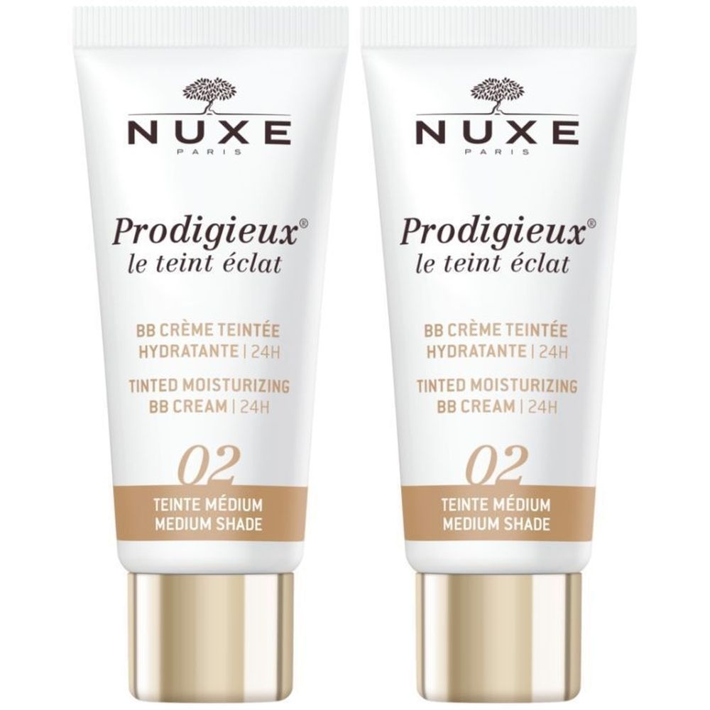 Twee tubes Nuxe Prodigieux BB Crème. Wit, bruine basis, gouden dop. Opschrift: 02 Teinte Médium.