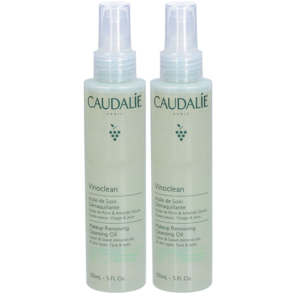 Twee flessen Caudalie Vinoclean Makeup Removing Cleansing Oil. Lichtgroene flessen met verstuiver. Opschrift: Caudalie, Vinoclean, Makeup Removing Cleansing Oil.