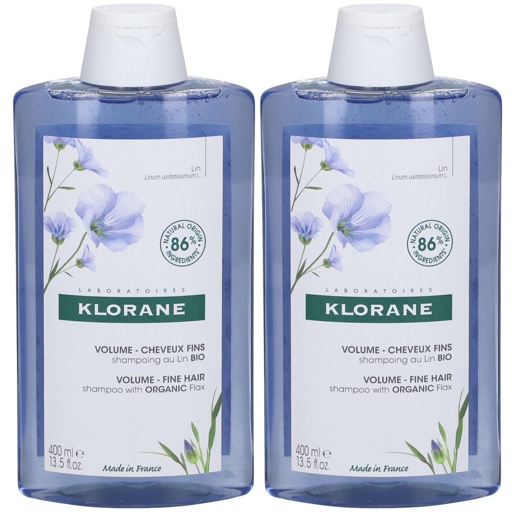 Twee blauwe shampoo flessen met wit etiket. Opschrift: KLORANE, VOLUME, shampoo voor fijn haar met biologisch vlas. 86% natuurlijke ingrediënten.