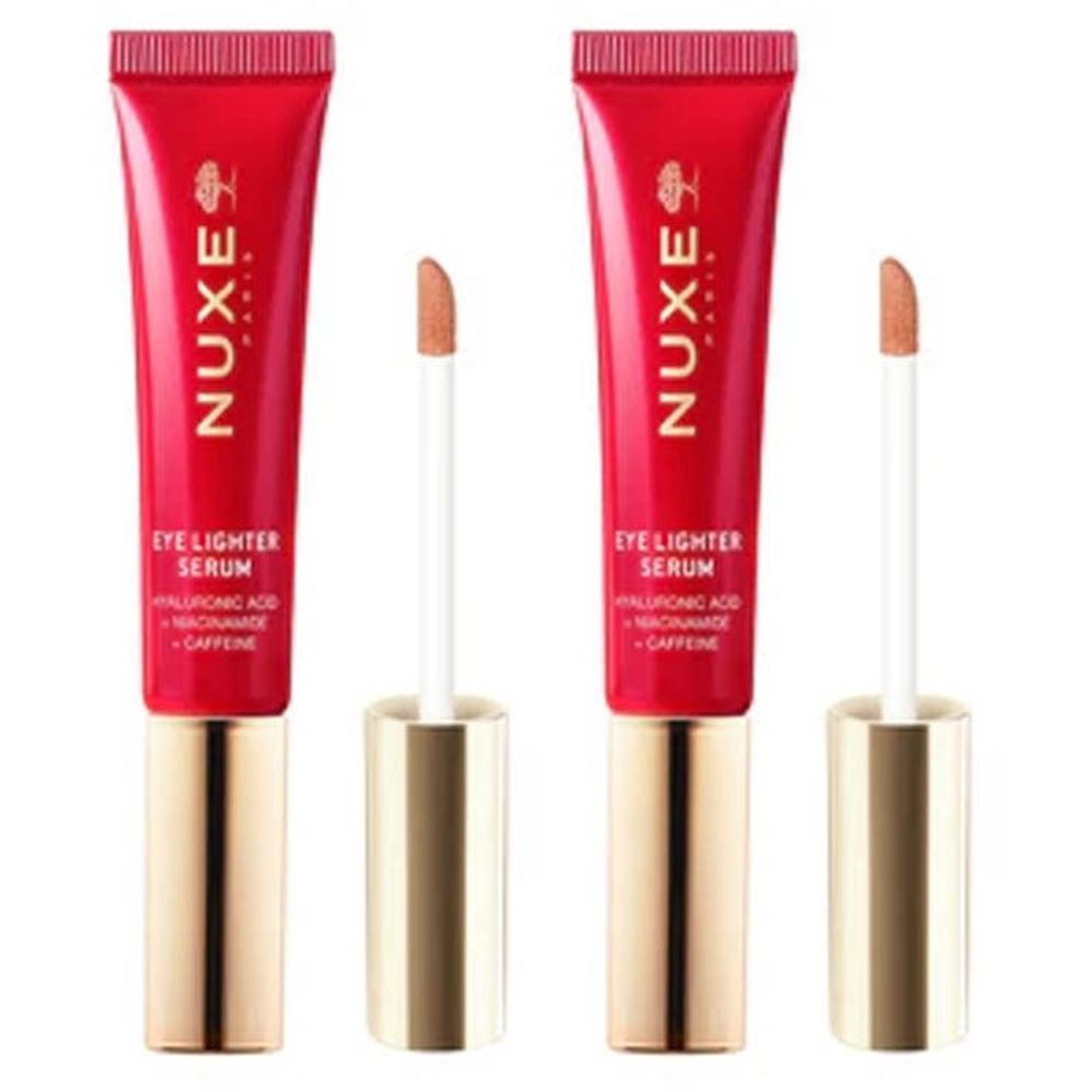 Deux tubes rouges avec bouchons dorés et applicateurs. Inscription : Nuxe, Eye Lighter Serum. Contient acide hyaluronique, niacinamide, caféine.