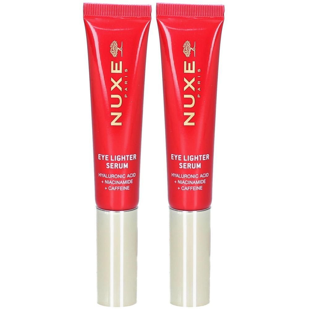 Twee rode tubes met gouden doppen. Opschrift: Nuxe Paris, Eye Lighter Serum, Hyaluronzuur, Niacinamide, Cafeïne.