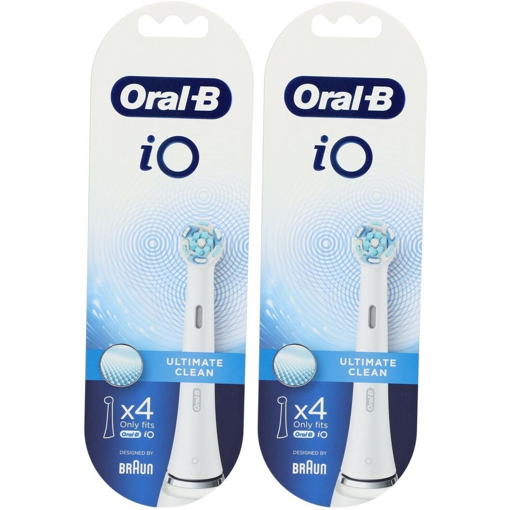 Twee verpakkingen met witte opzetborstels. Opschrift Oral-B iO, Ultimate Clean. Bevat 4 stuks. Ontworpen door Braun.