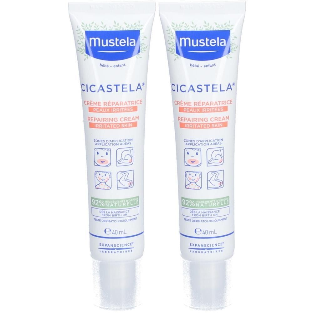 Twee tubes Mustela CICASTELA Crème réparatrice. Witte tubes, blauwe dop, tekst. 92% natuurlijke ingrediënten.