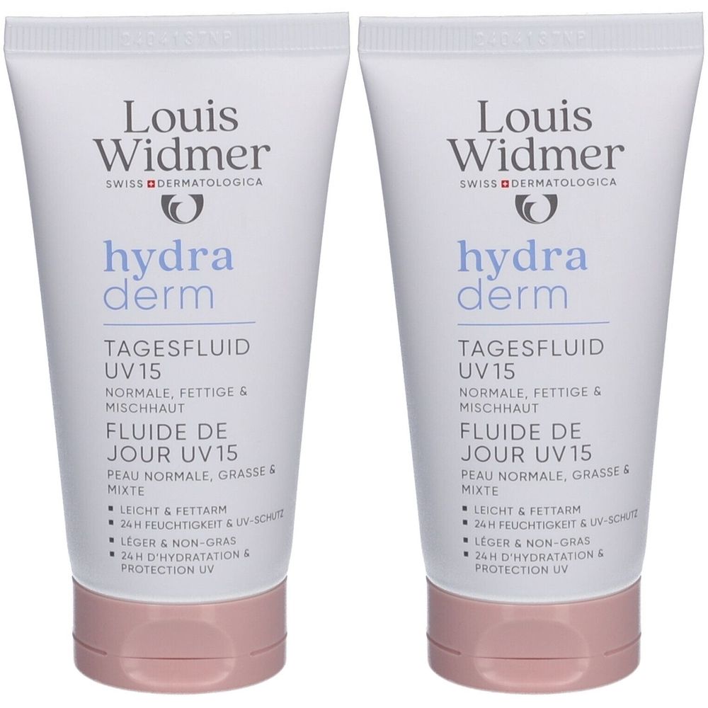 Twee tubes Louis Widmer Hydraderm Dagfluïde UV15. Wit, roze dop. Opschrift: hydra derm, UV15, 24u hydratatie.